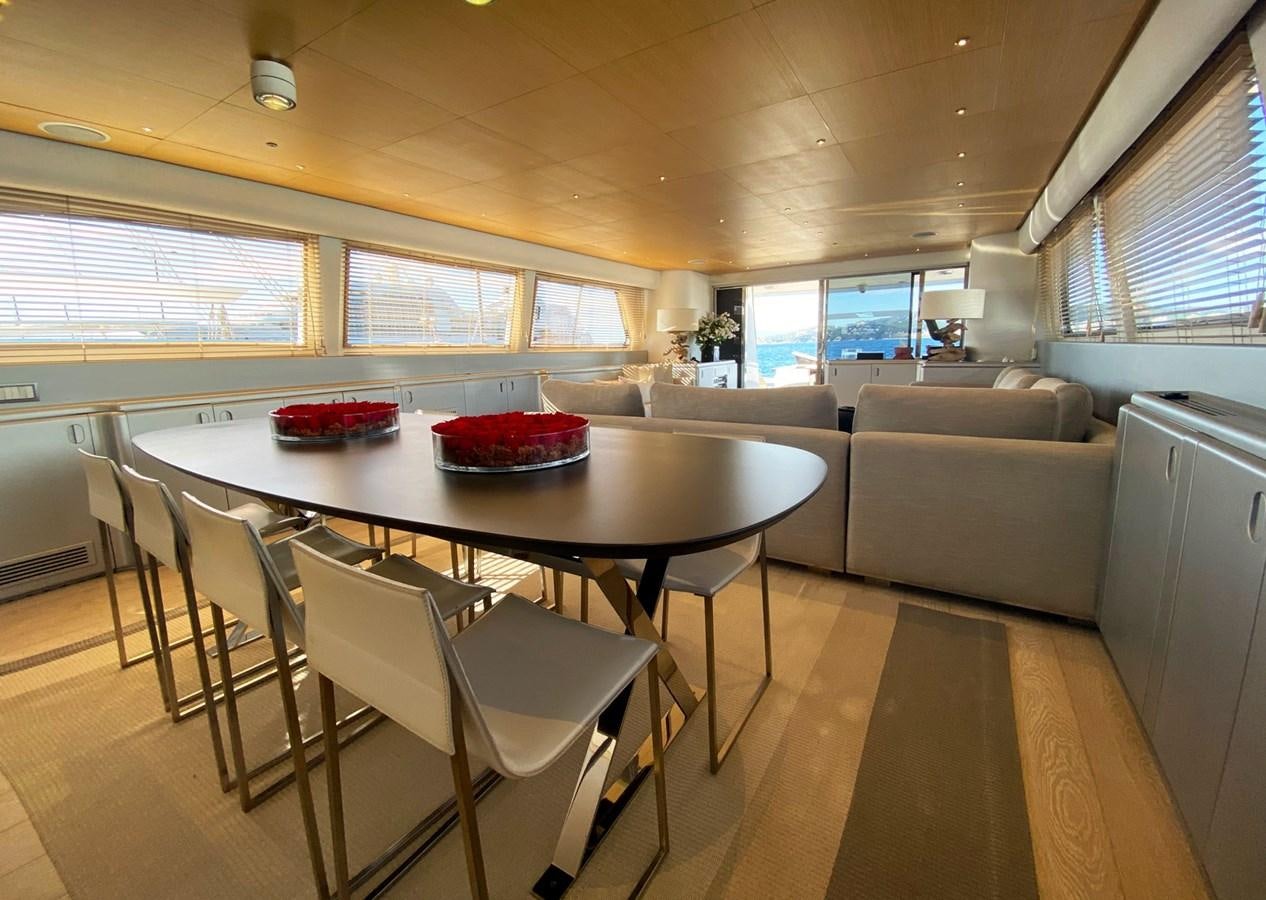a large room with a table and chairs aboard PETARDO C Yacht for Sale
