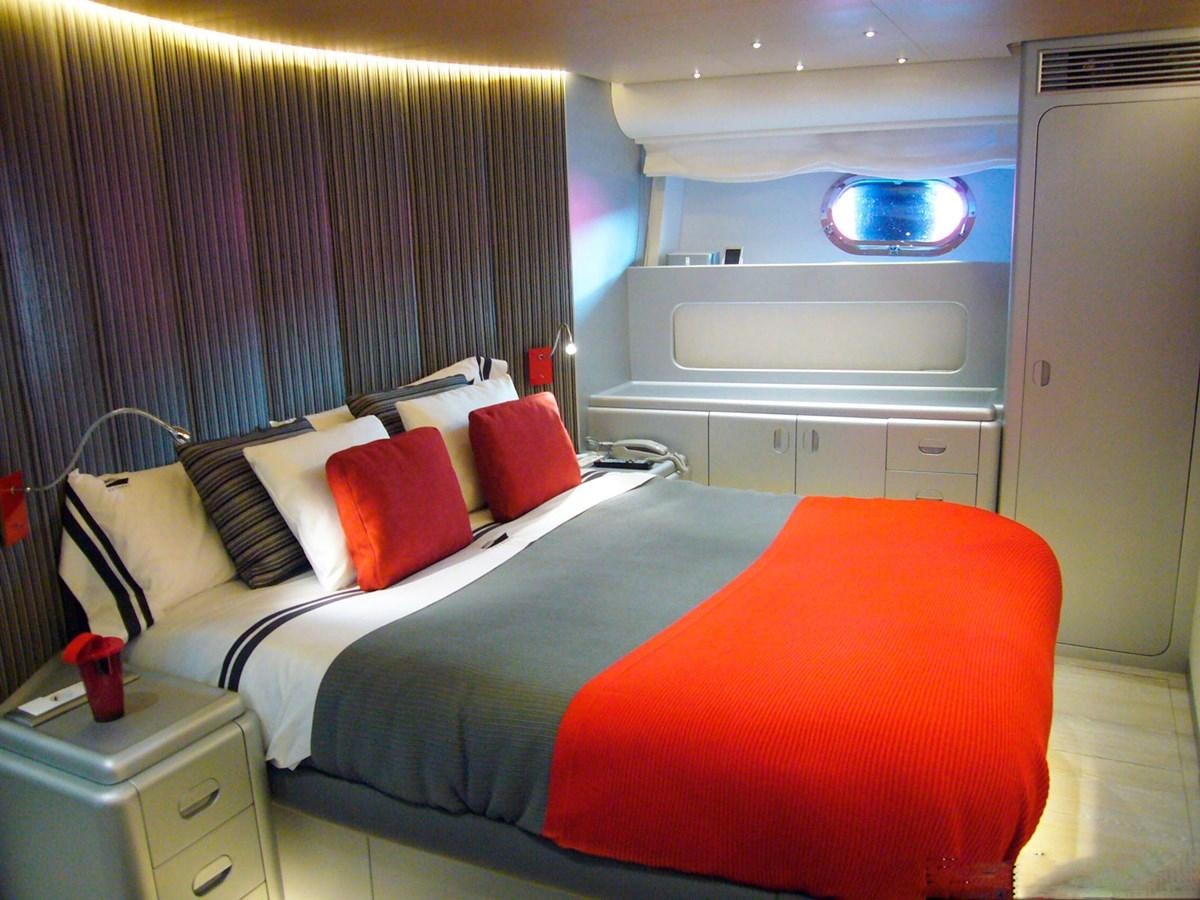 a bed in a room aboard PETARDO C Yacht for Sale