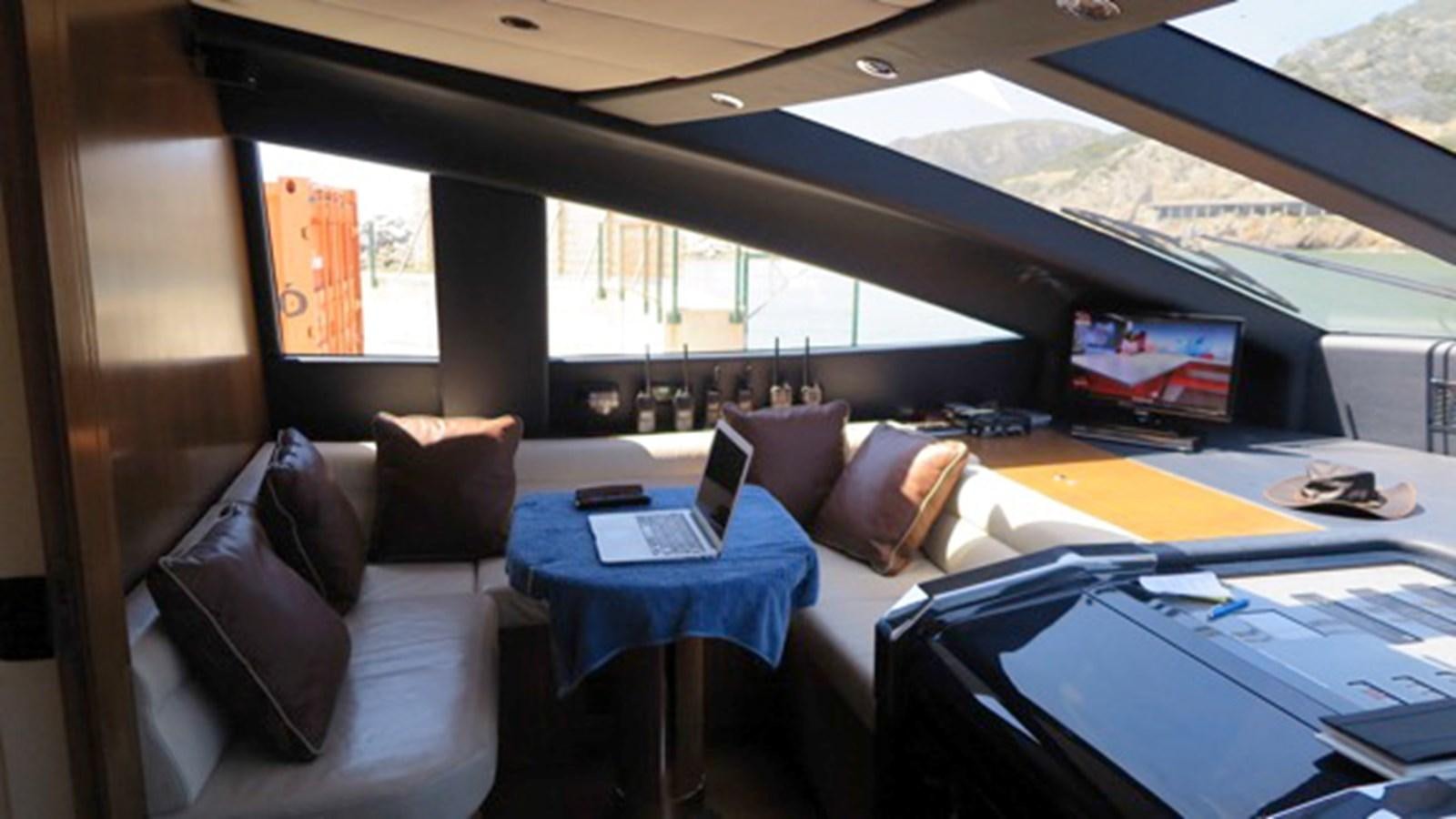 a room with a couch and a laptop aboard RIVA 85 OPERA Yacht for Sale