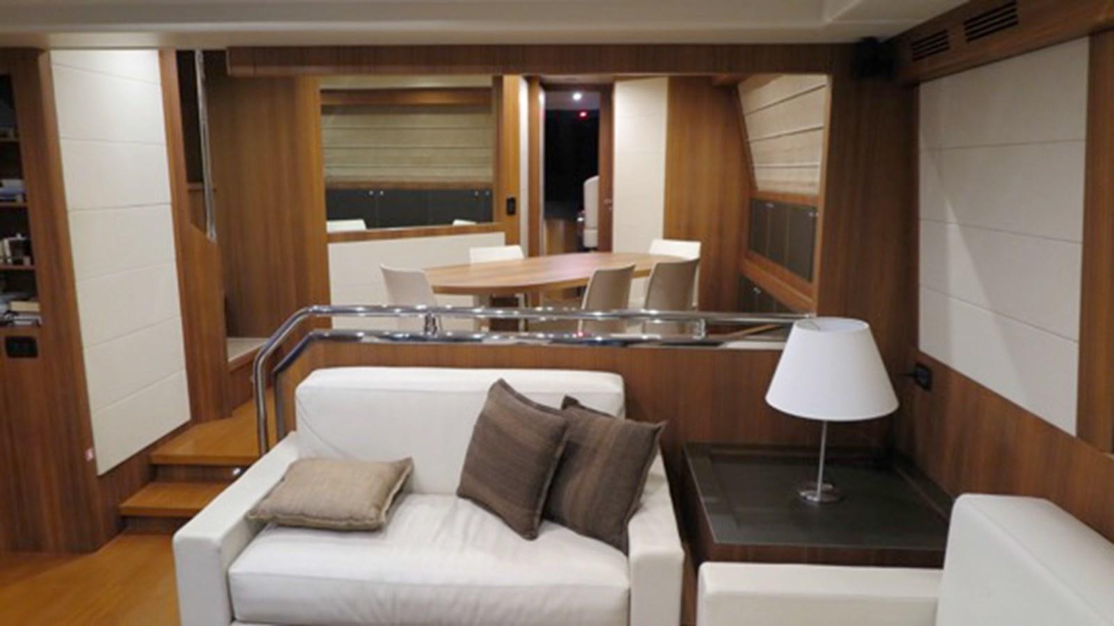 a room with a bed and a table aboard RIVA 85 OPERA Yacht for Sale