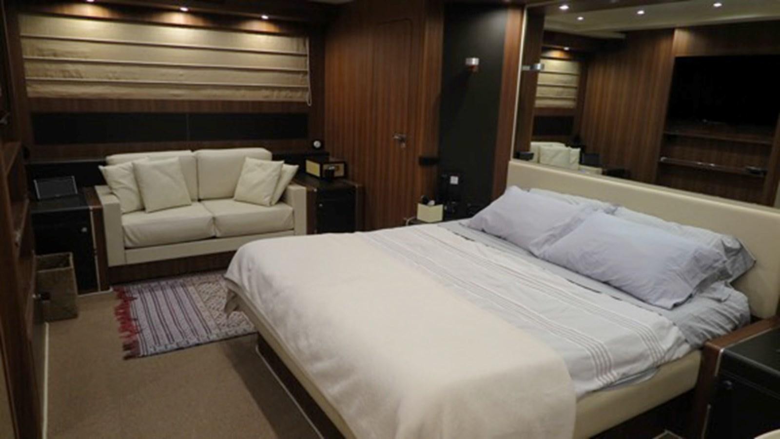 a room with a bed and a couch aboard RIVA 85 OPERA Yacht for Sale