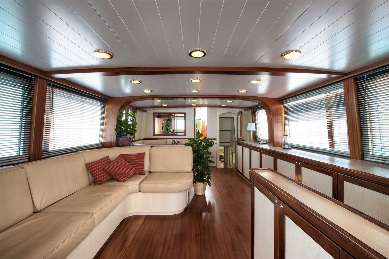 a large living room with a wood floor and a wood floor aboard EMERALD Yacht for Sale