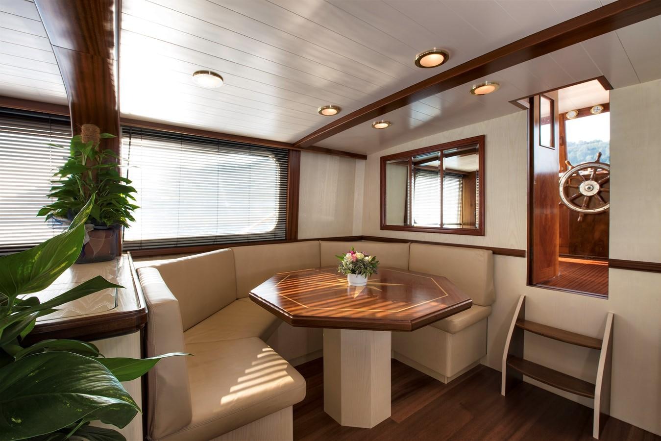 a room with a table and chairs aboard EMERALD Yacht for Sale