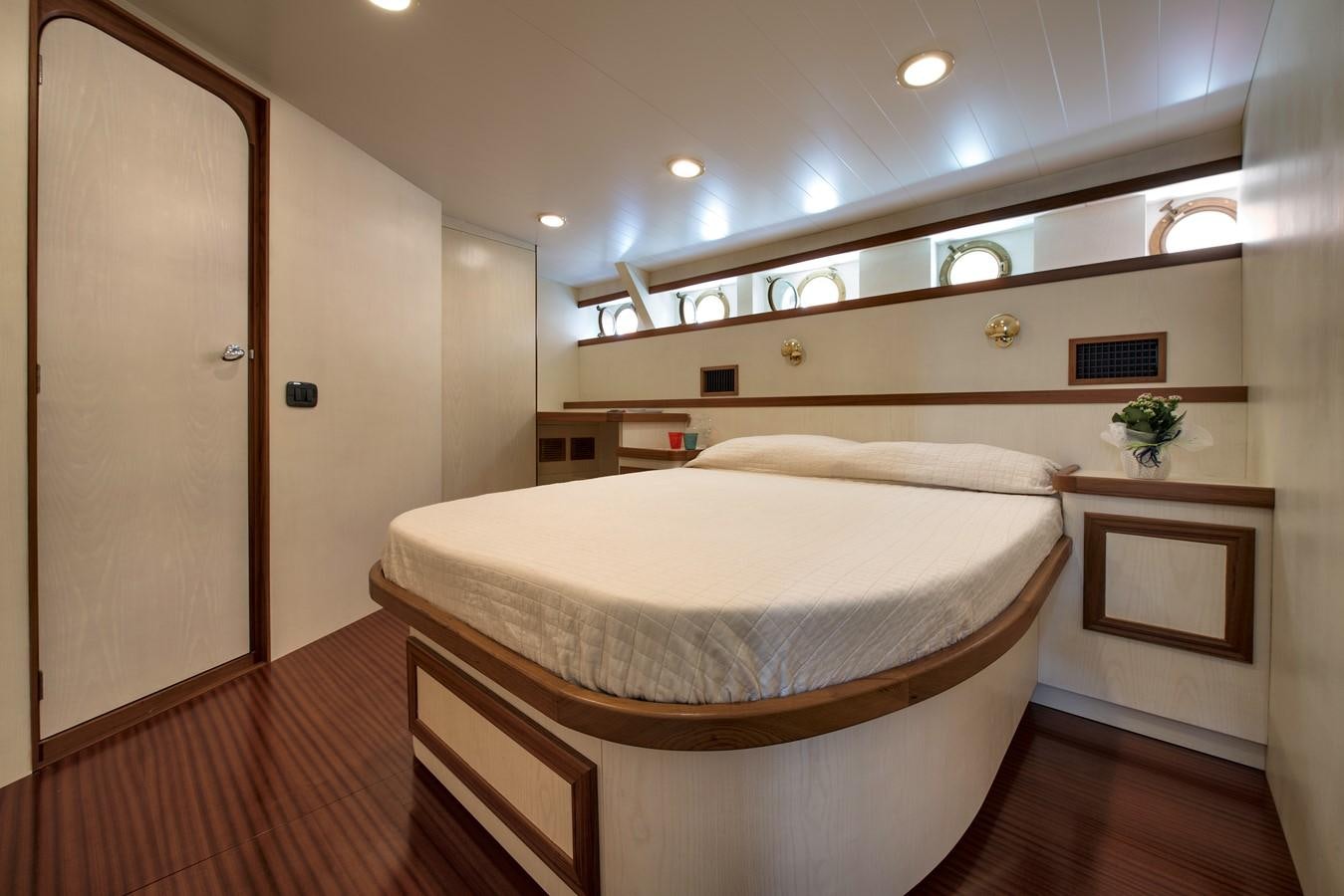 a large bedroom with a large bed aboard EMERALD Yacht for Sale