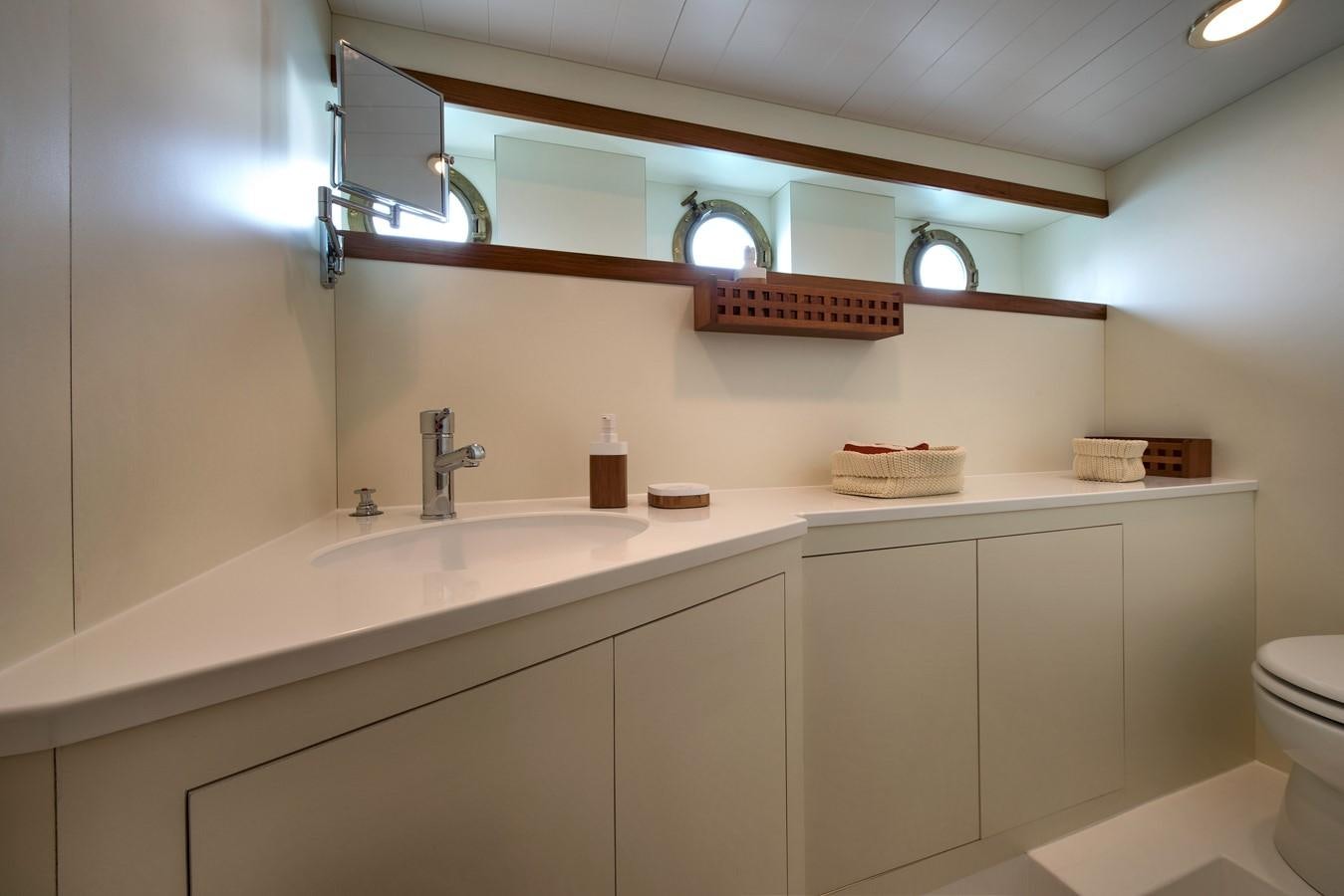 a bathroom with a sink and a mirror aboard EMERALD Yacht for Sale