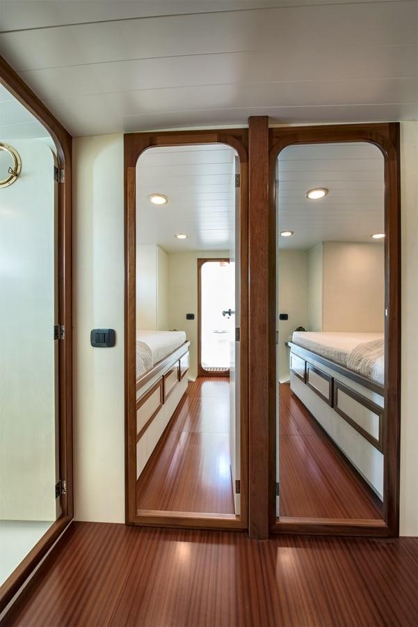 a room with a wood floor and a mirror aboard EMERALD Yacht for Sale