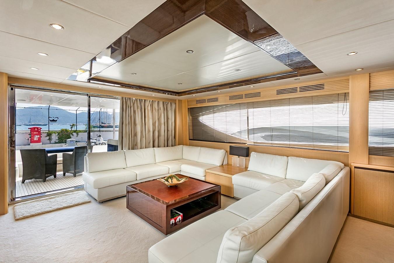 a living room with a large window aboard DREAM ON Yacht for Sale