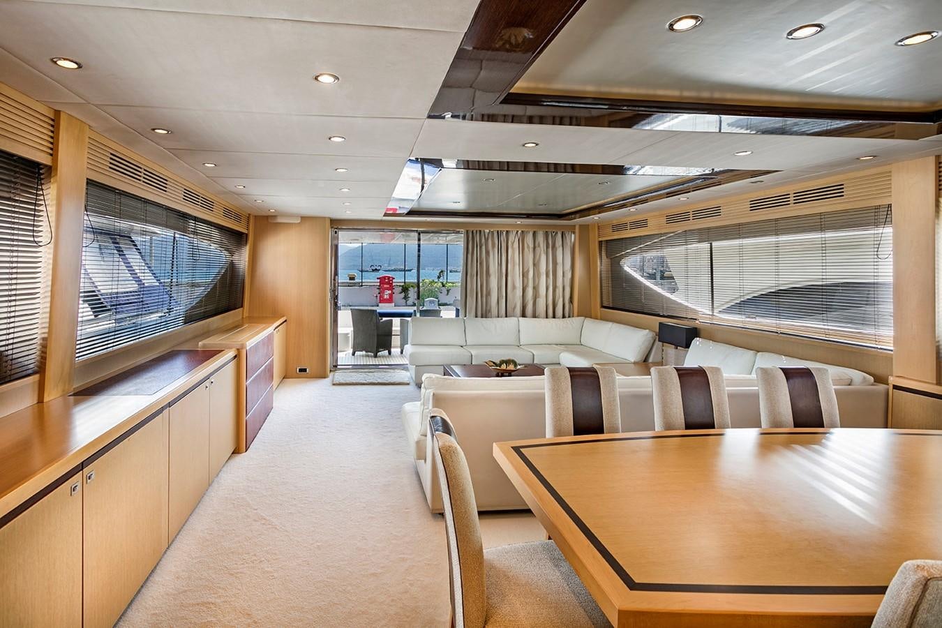 a room with a large table and chairs aboard DREAM ON Yacht for Sale