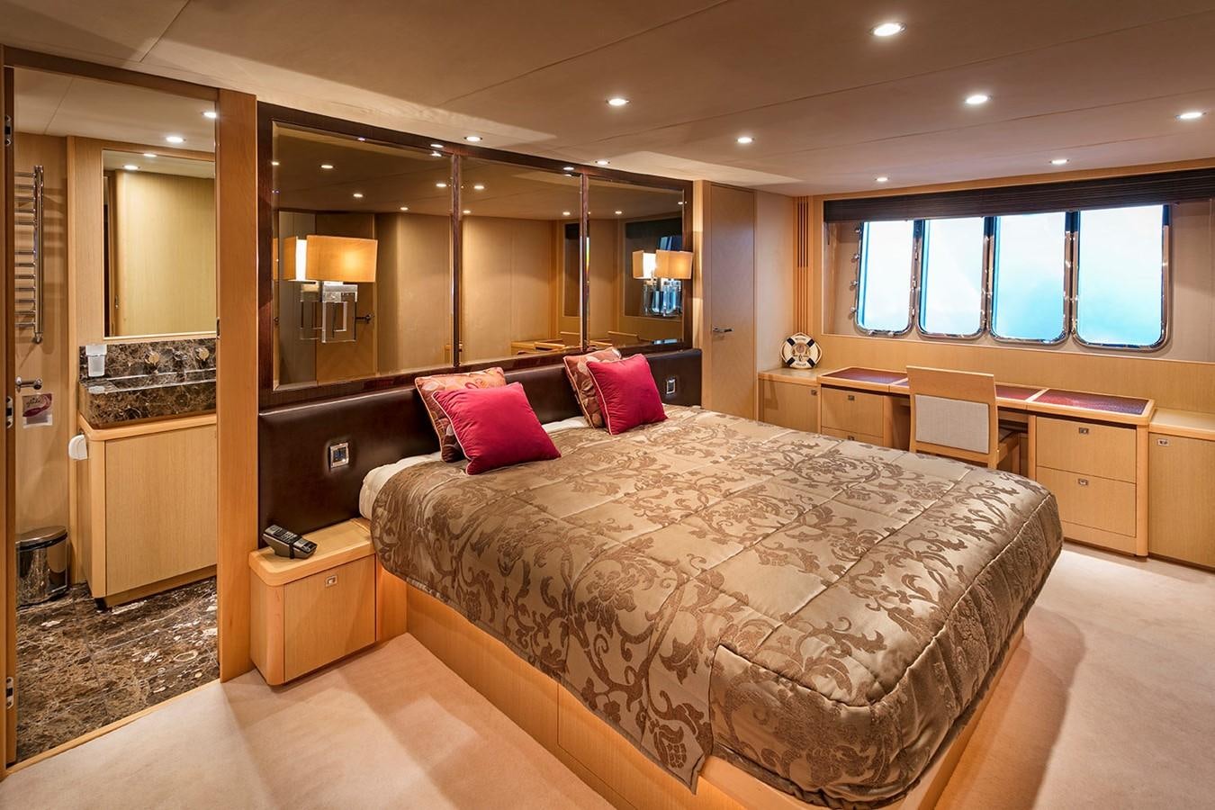 a large bedroom with a bed aboard DREAM ON Yacht for Sale