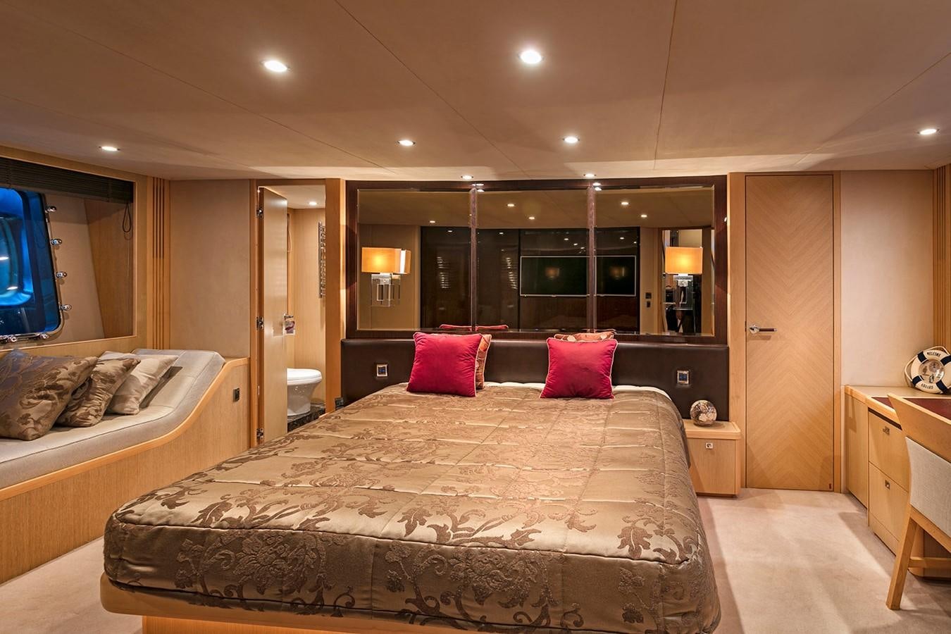 a large bedroom with a large bed aboard DREAM ON Yacht for Sale