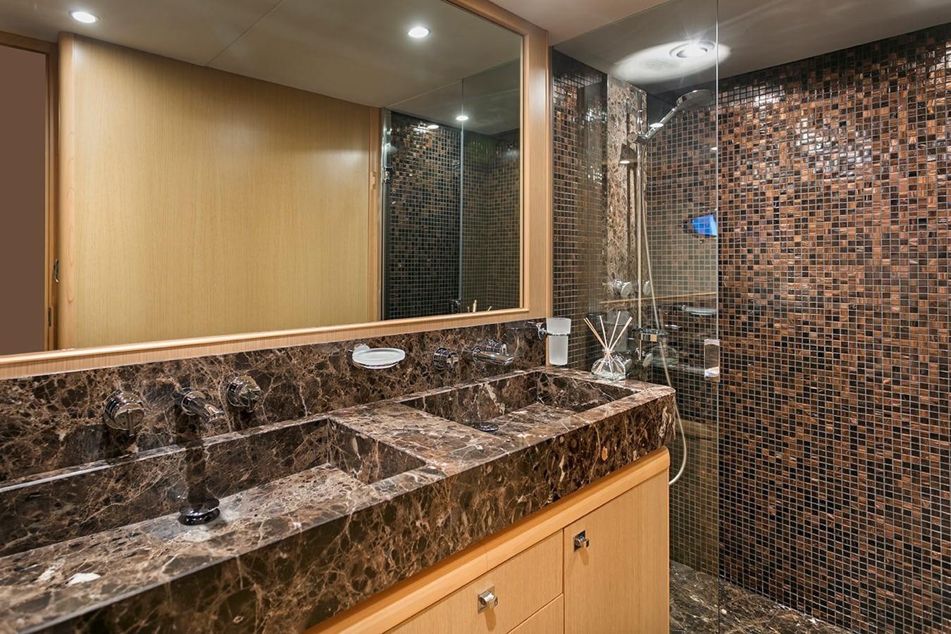 a bathroom with marble counter tops aboard DREAM ON Yacht for Sale