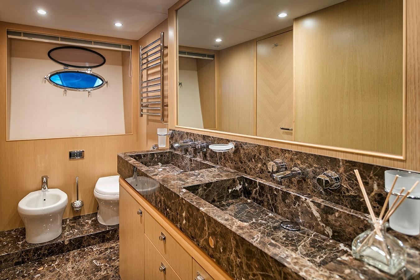 a bathroom with a marble counter top aboard DREAM ON Yacht for Sale