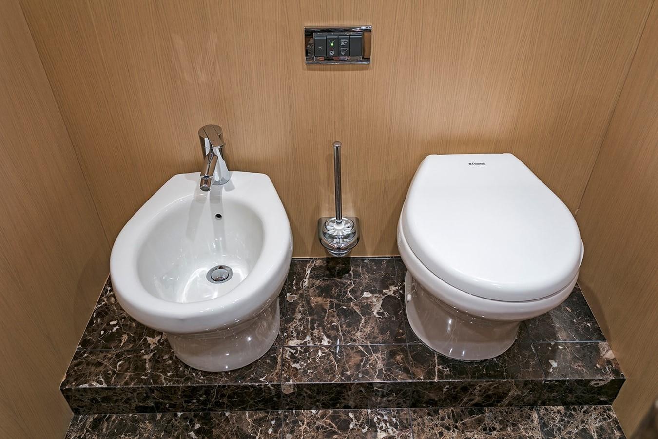 a couple of toilets sit near each other aboard DREAM ON Yacht for Sale