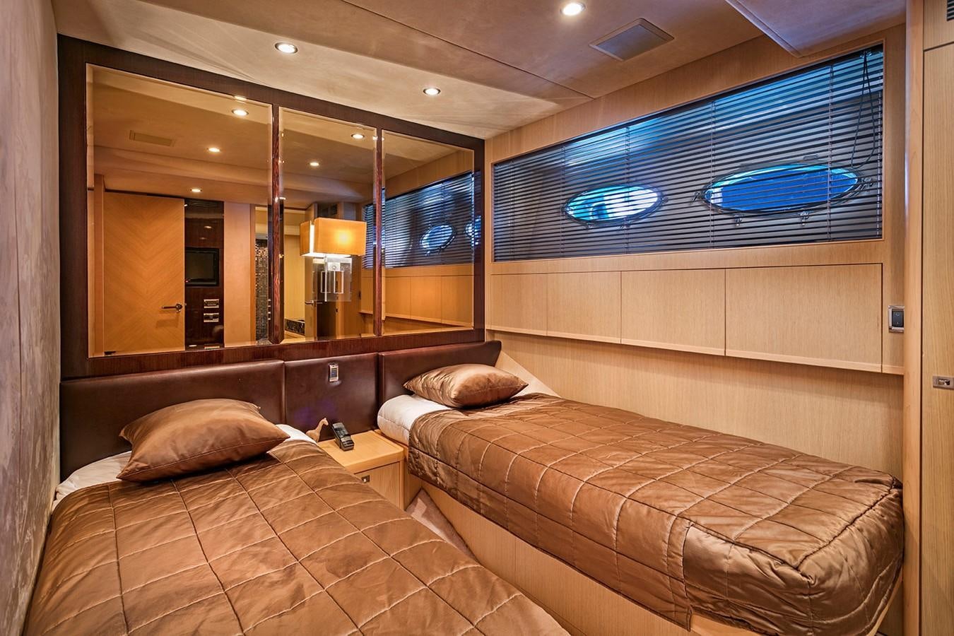 a room with a bed and a mirror aboard DREAM ON Yacht for Sale