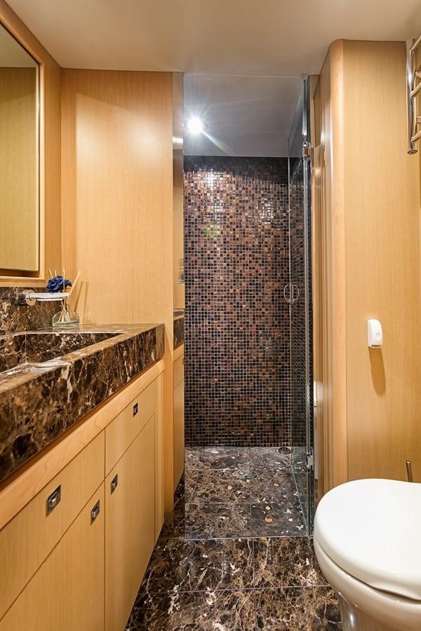 a bathroom with a shower and a toilet aboard DREAM ON Yacht for Sale