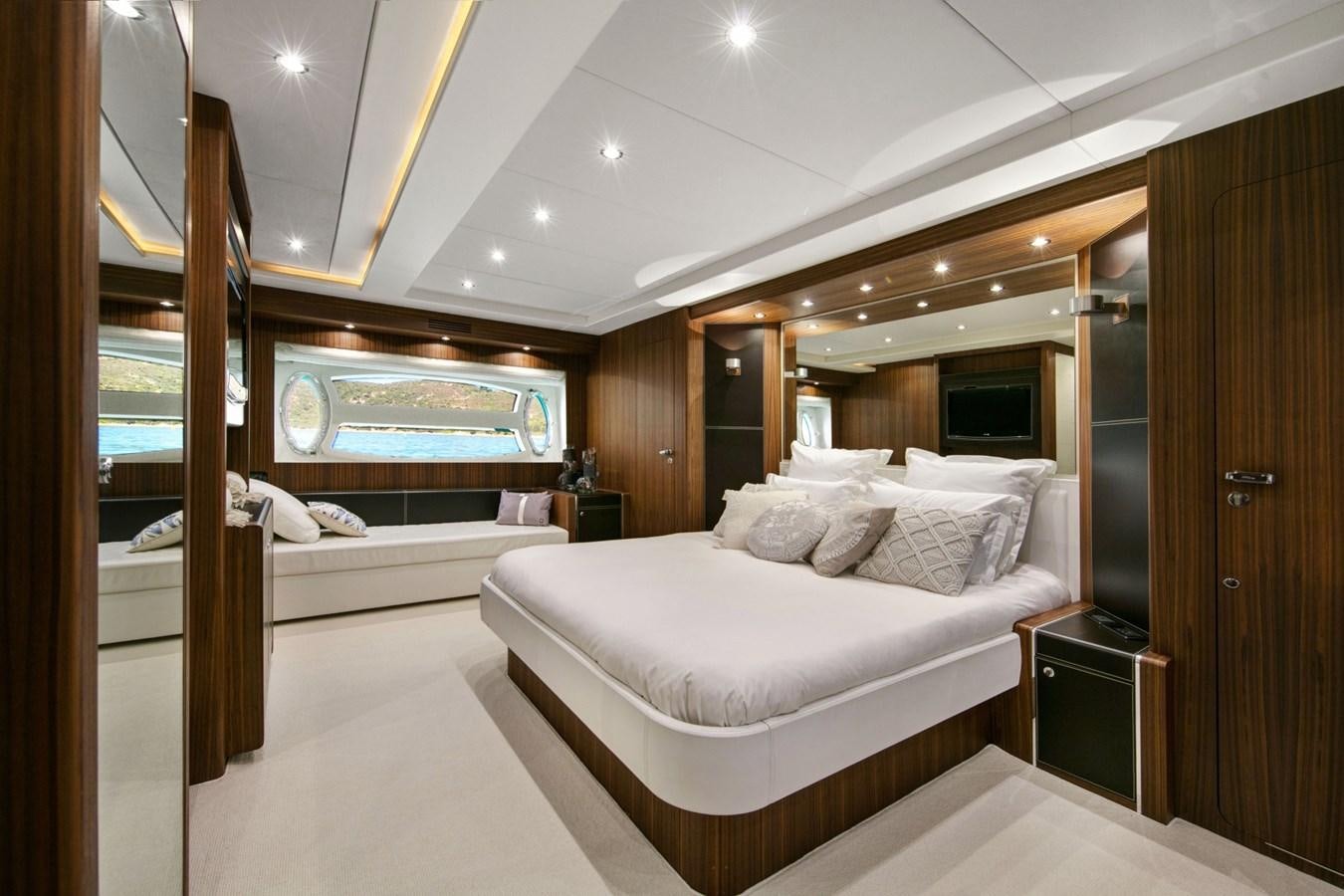 a room with a bed and a mirror aboard BLACK PEARL AJACCIO Yacht for Sale