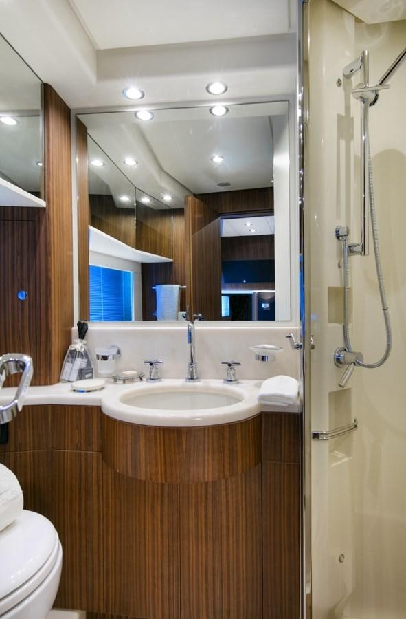 a bathroom with a sink and a mirror aboard BLACK PEARL AJACCIO Yacht for Sale