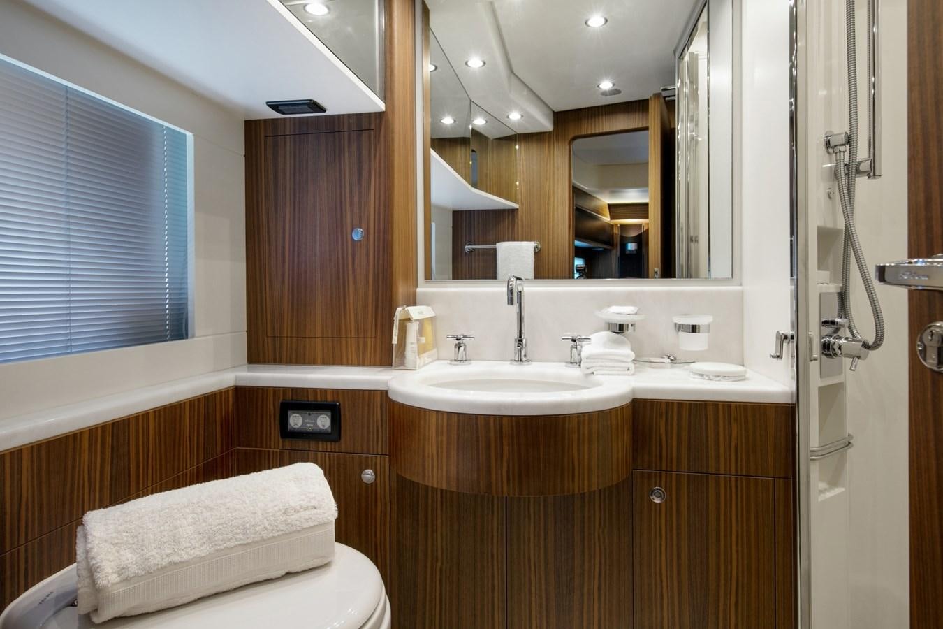 a bathroom with a large mirror aboard BLACK PEARL AJACCIO Yacht for Sale