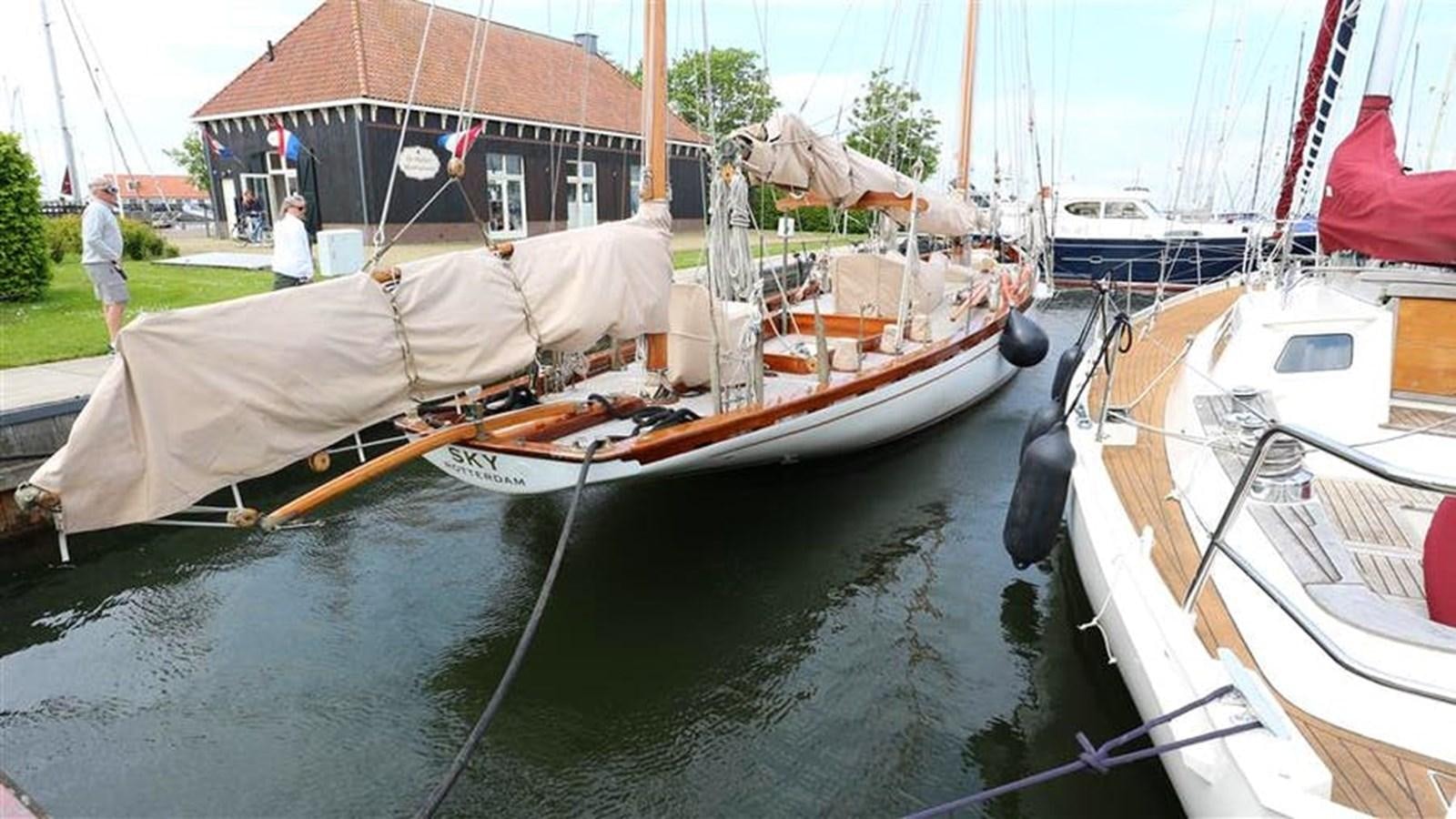 a group of boats are parked in a harbor aboard SKY Yacht for Sale
