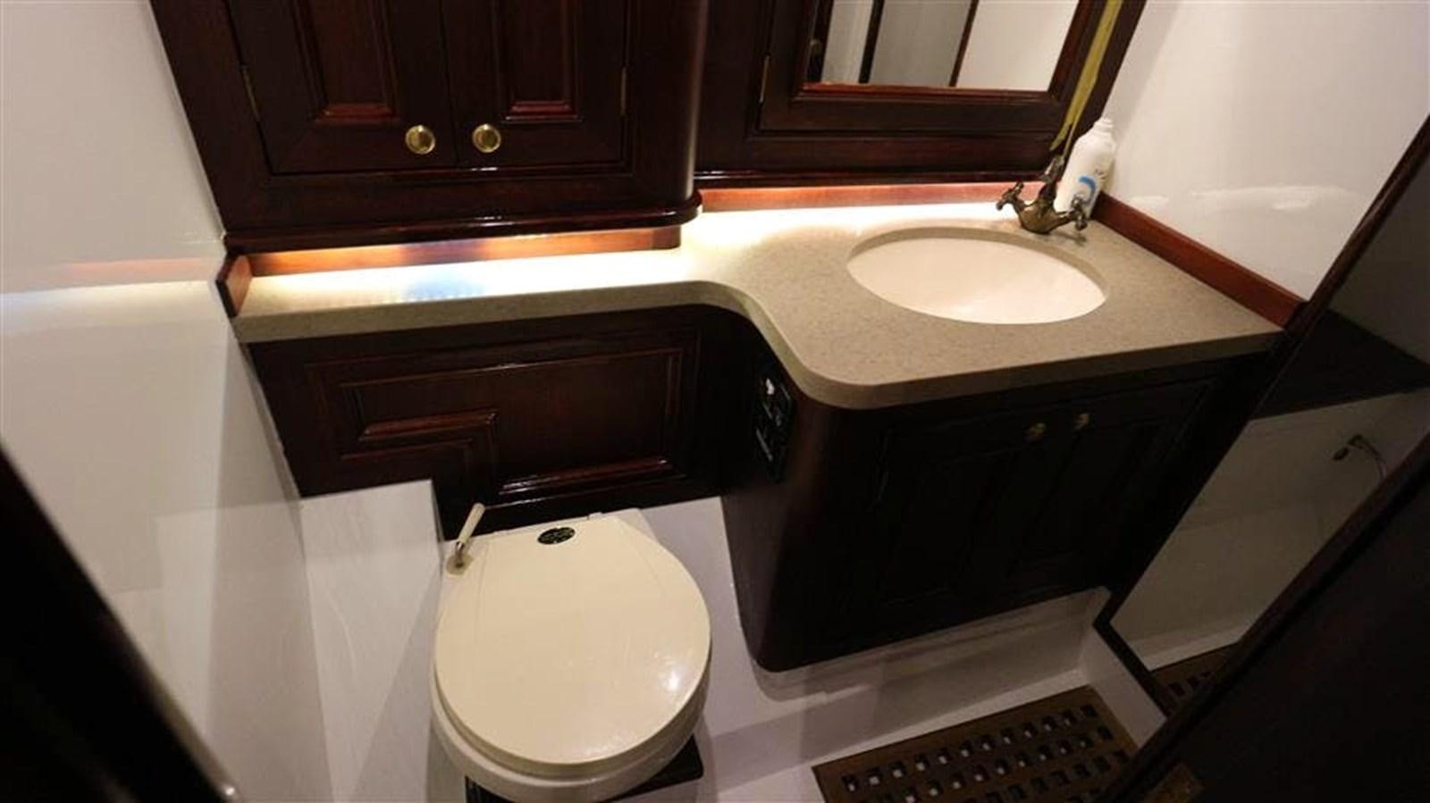 a bathroom with a sink and a toilet aboard SKY Yacht for Sale