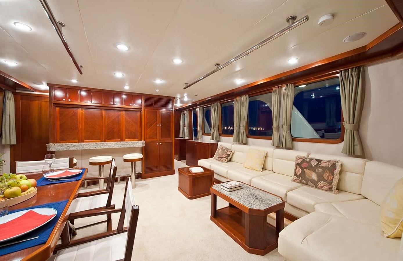 a living room with a large window aboard BELEZA Yacht for Sale