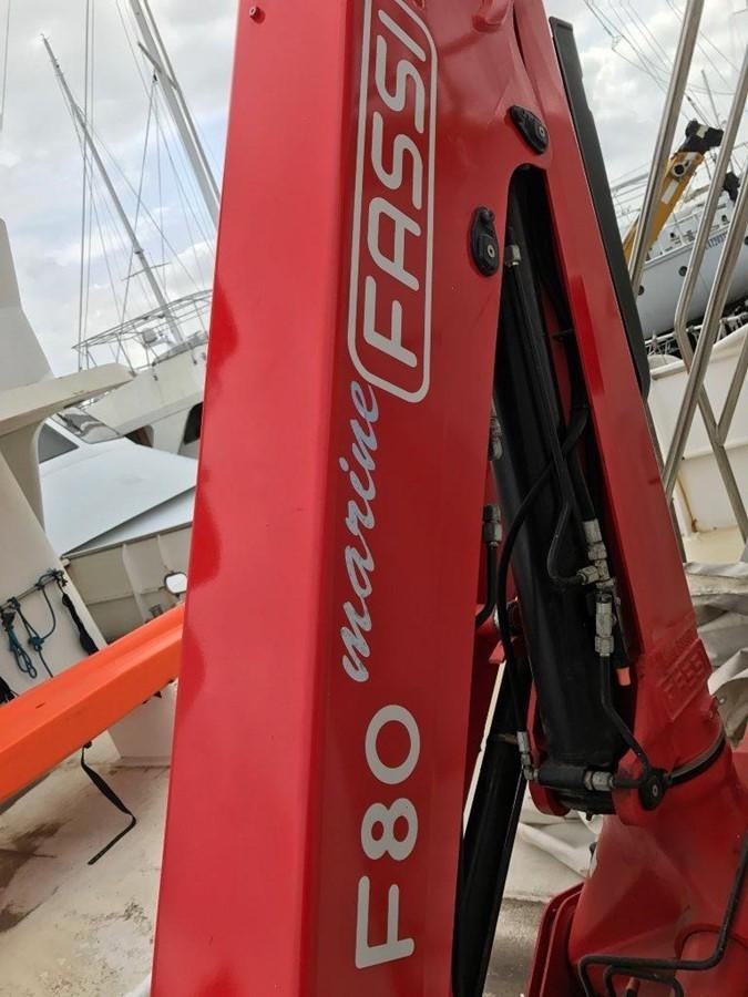 a red and white boat aboard BELEZA Yacht for Sale