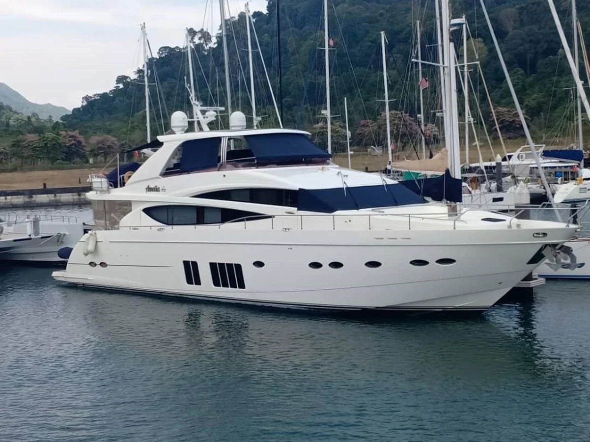 a white yacht in a harbor aboard PRINCESS 85MY Yacht for Sale