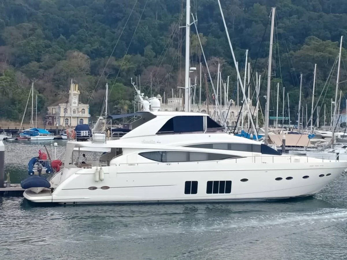 a white yacht in a harbor aboard PRINCESS 85MY Yacht for Sale