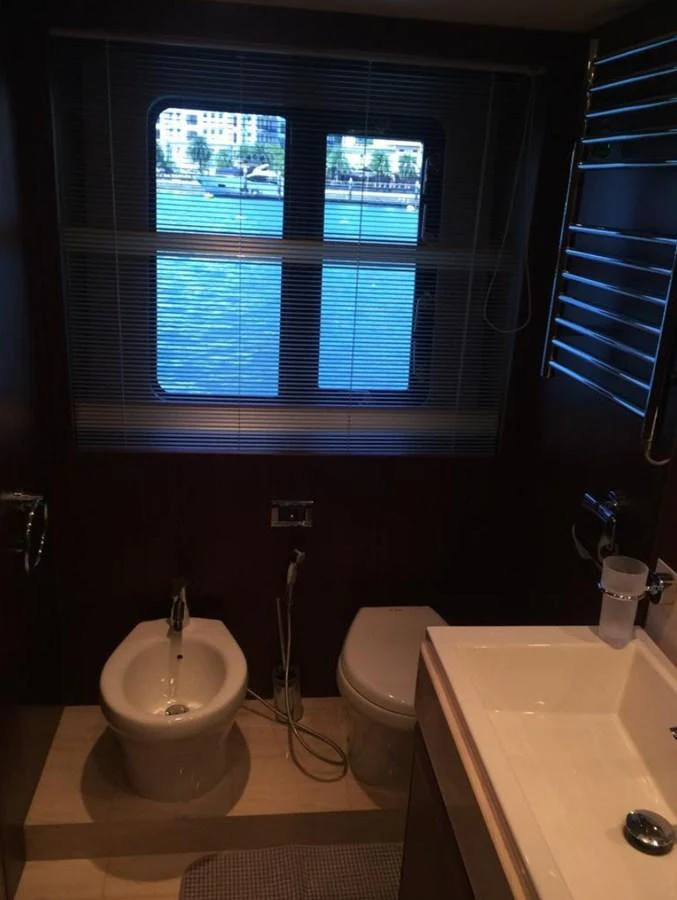 a bathroom with a window and a sink aboard PRINCESS 85MY Yacht for Sale