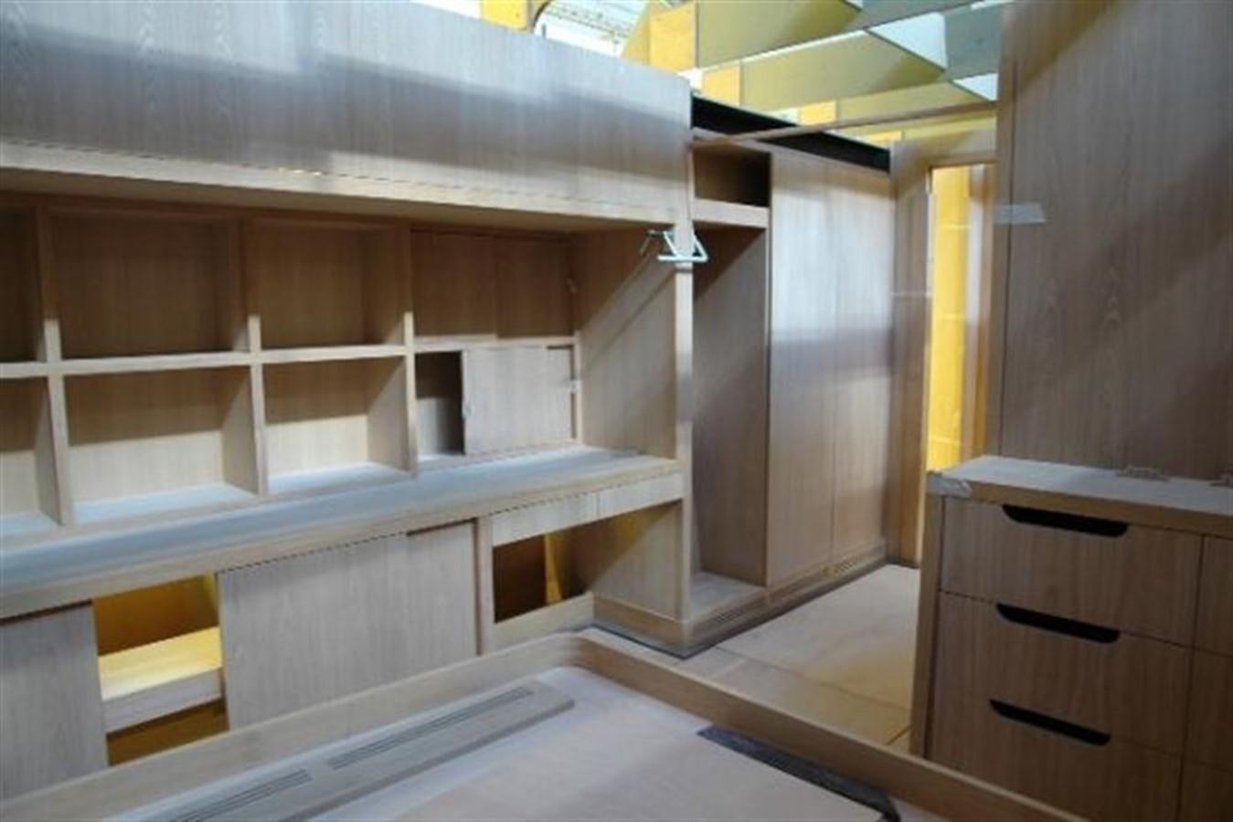 a room with cabinets and a shelf aboard 85' 2008 YAPLUKA 85 DOUBLE DECK Yacht for Sale