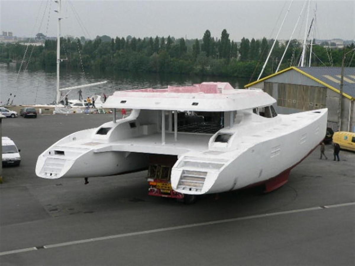 a white boat on a trailer aboard 85' 2008 YAPLUKA 85 DOUBLE DECK Yacht for Sale