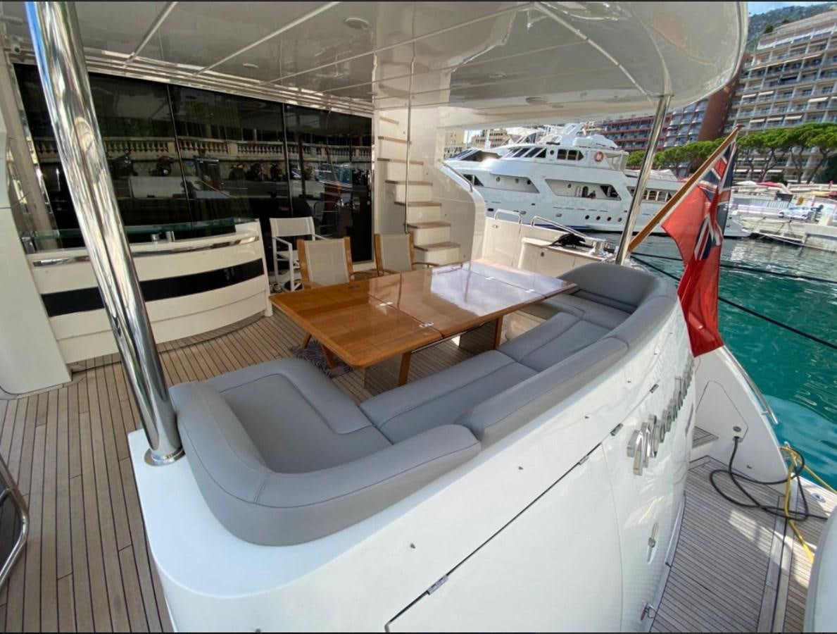 a room with a table and chairs aboard MOONDANCER Yacht for Sale