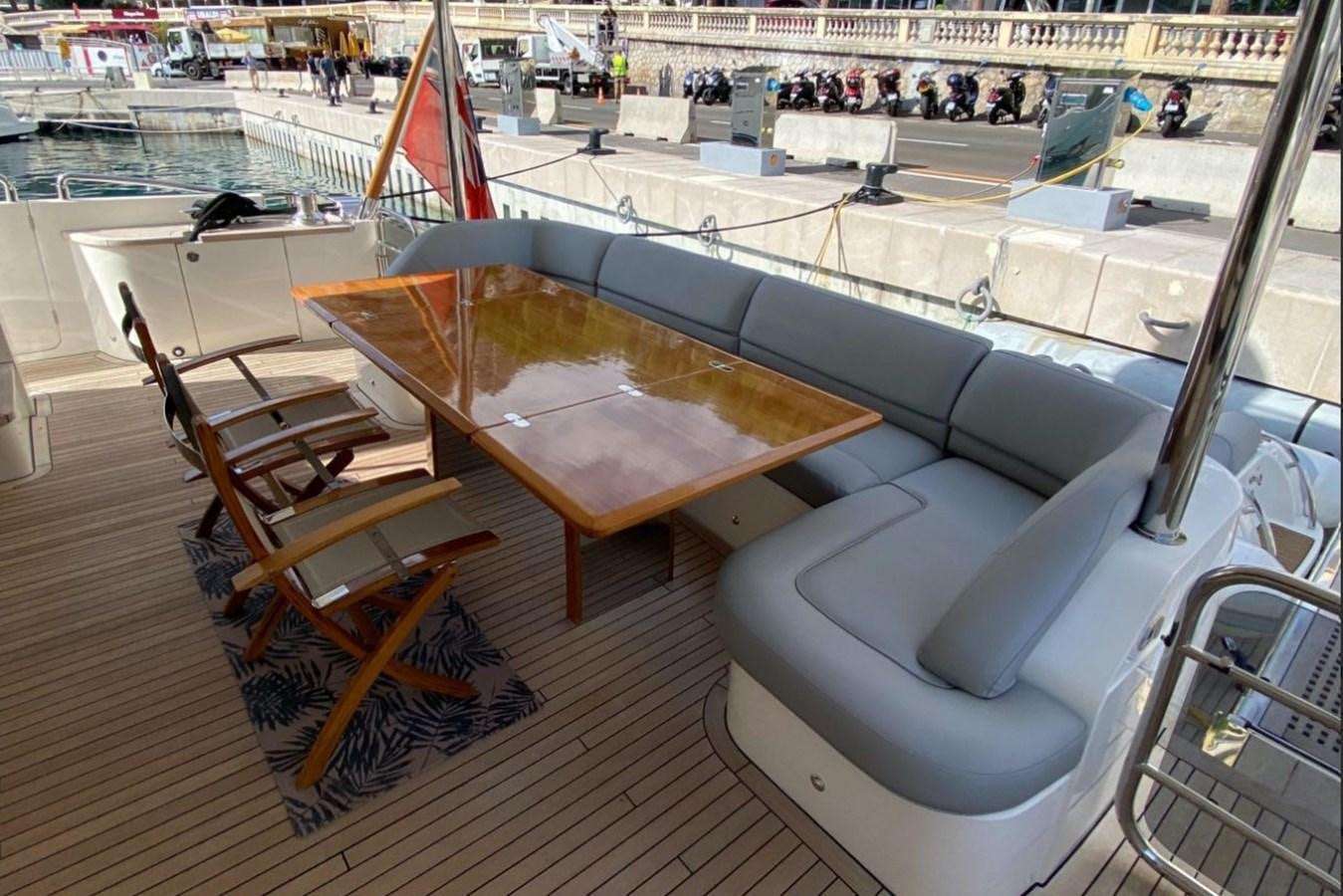 a room with chairs and tables aboard MOONDANCER Yacht for Sale