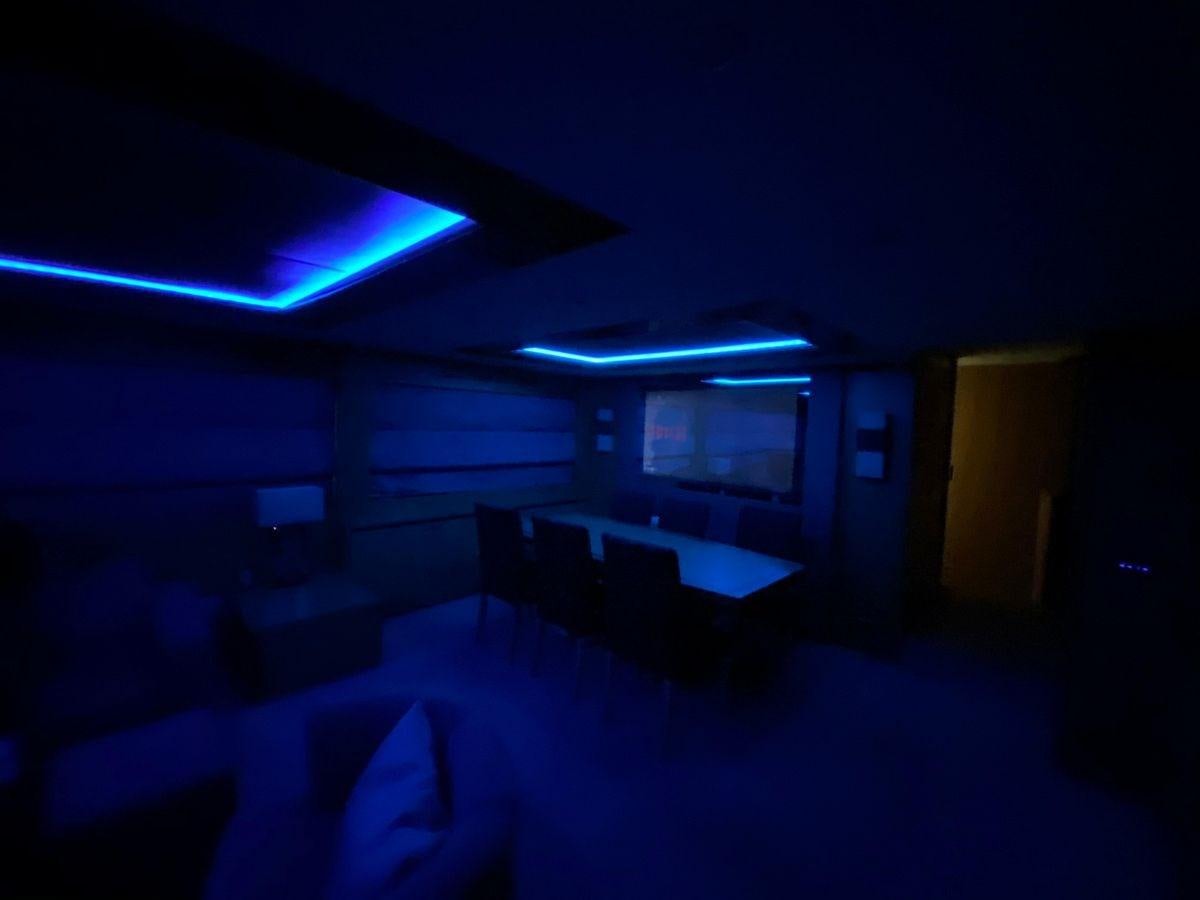 a dark room with a computer and a blue light aboard MOONDANCER Yacht for Sale