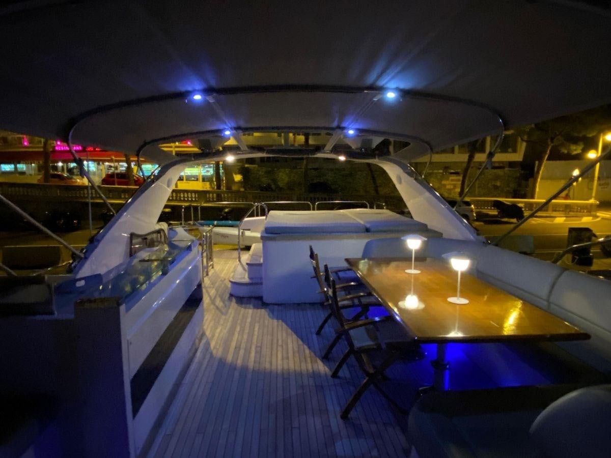 a large room with a pool table and chairs aboard MOONDANCER Yacht for Sale