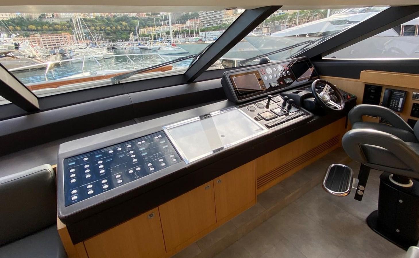 a desk with a computer and other electronics on it aboard MOONDANCER Yacht for Sale