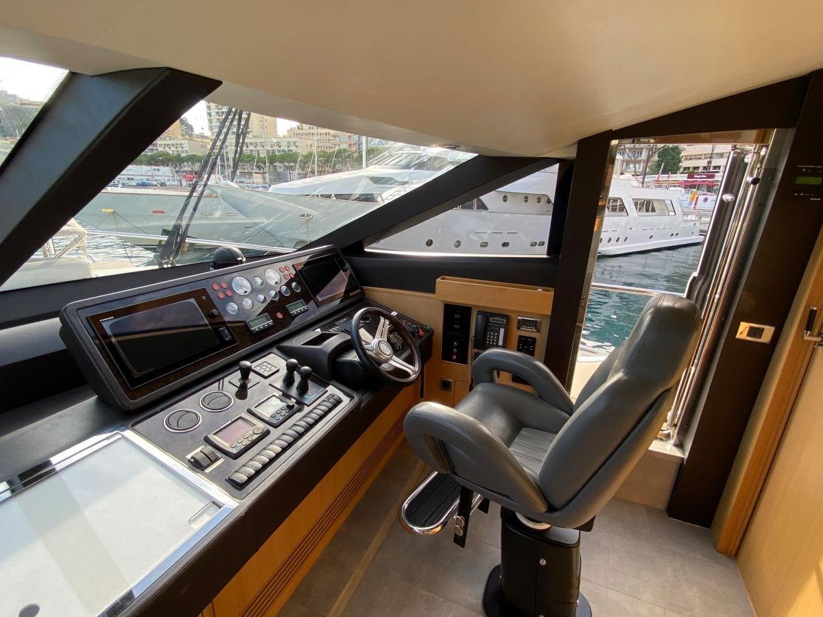 a car with a radio in the passenger seat aboard MOONDANCER Yacht for Sale