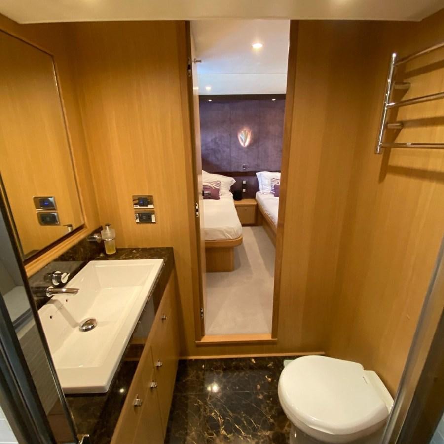 a bathroom with a sink and a toilet aboard MOONDANCER Yacht for Sale