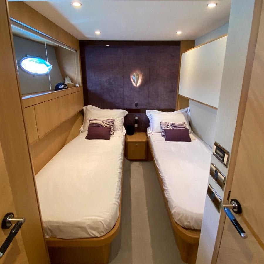 a room with a couple of beds aboard MOONDANCER Yacht for Sale
