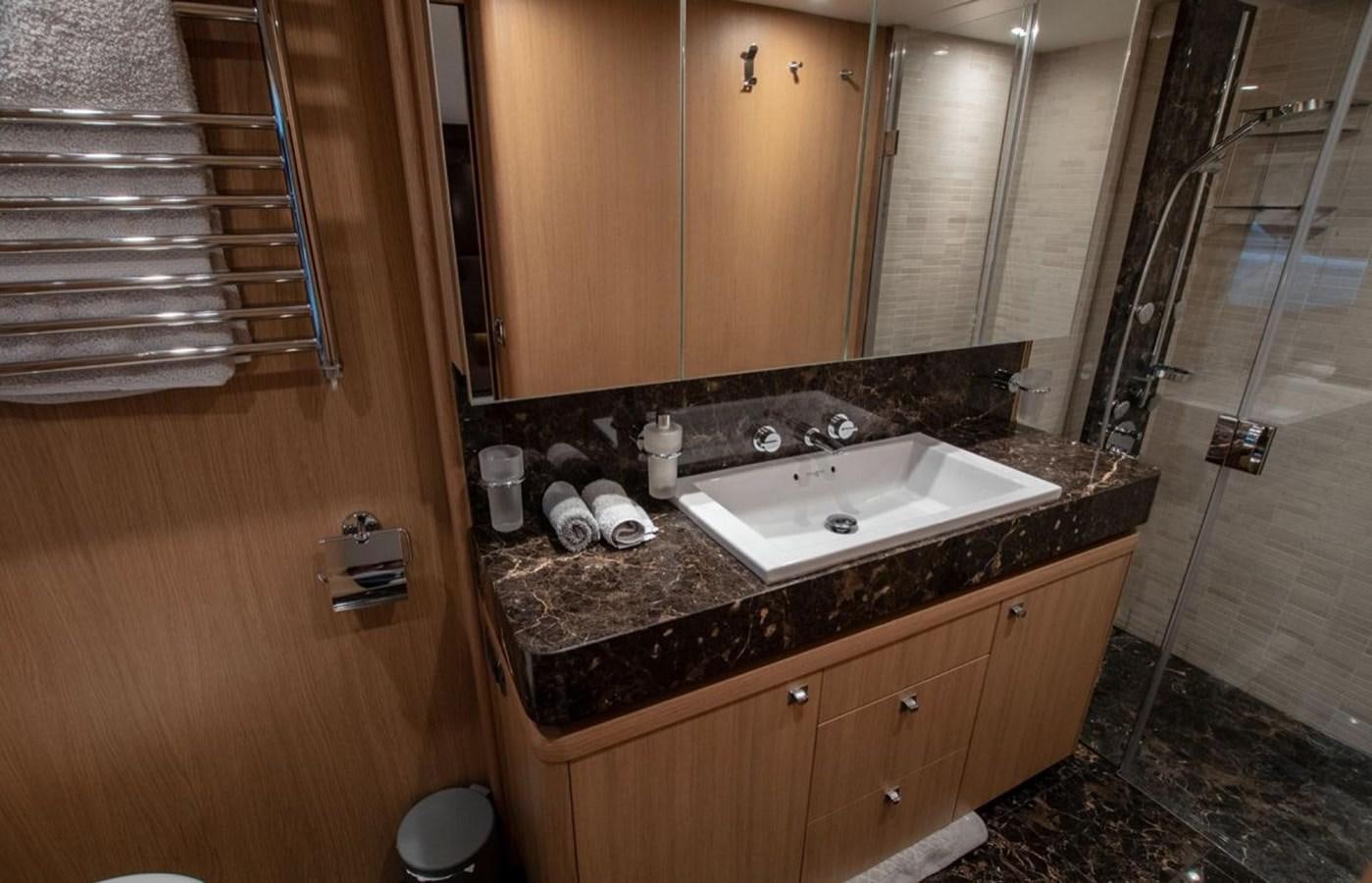 a bathroom with a sink and a mirror aboard MOONDANCER Yacht for Sale