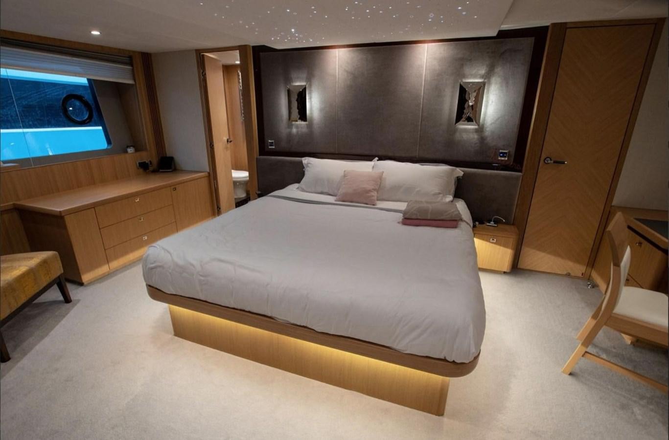 a large bed in a room aboard MOONDANCER Yacht for Sale
