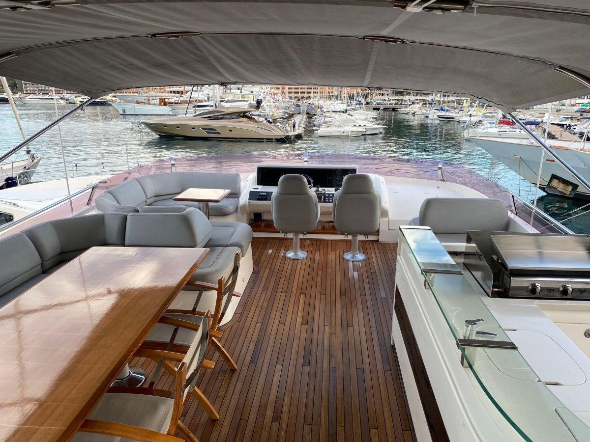 a deck with a deck overlooking a body of water aboard MOONDANCER Yacht for Sale