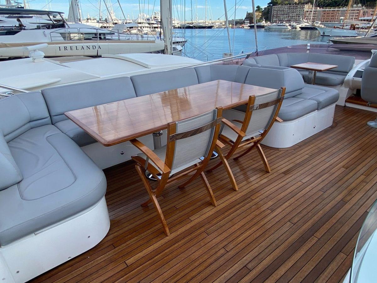 a wooden table on a boat aboard MOONDANCER Yacht for Sale