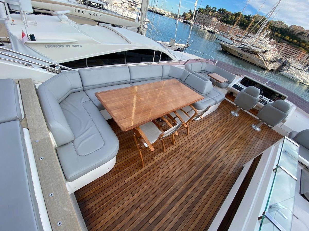 a room with a table and chairs aboard MOONDANCER Yacht for Sale