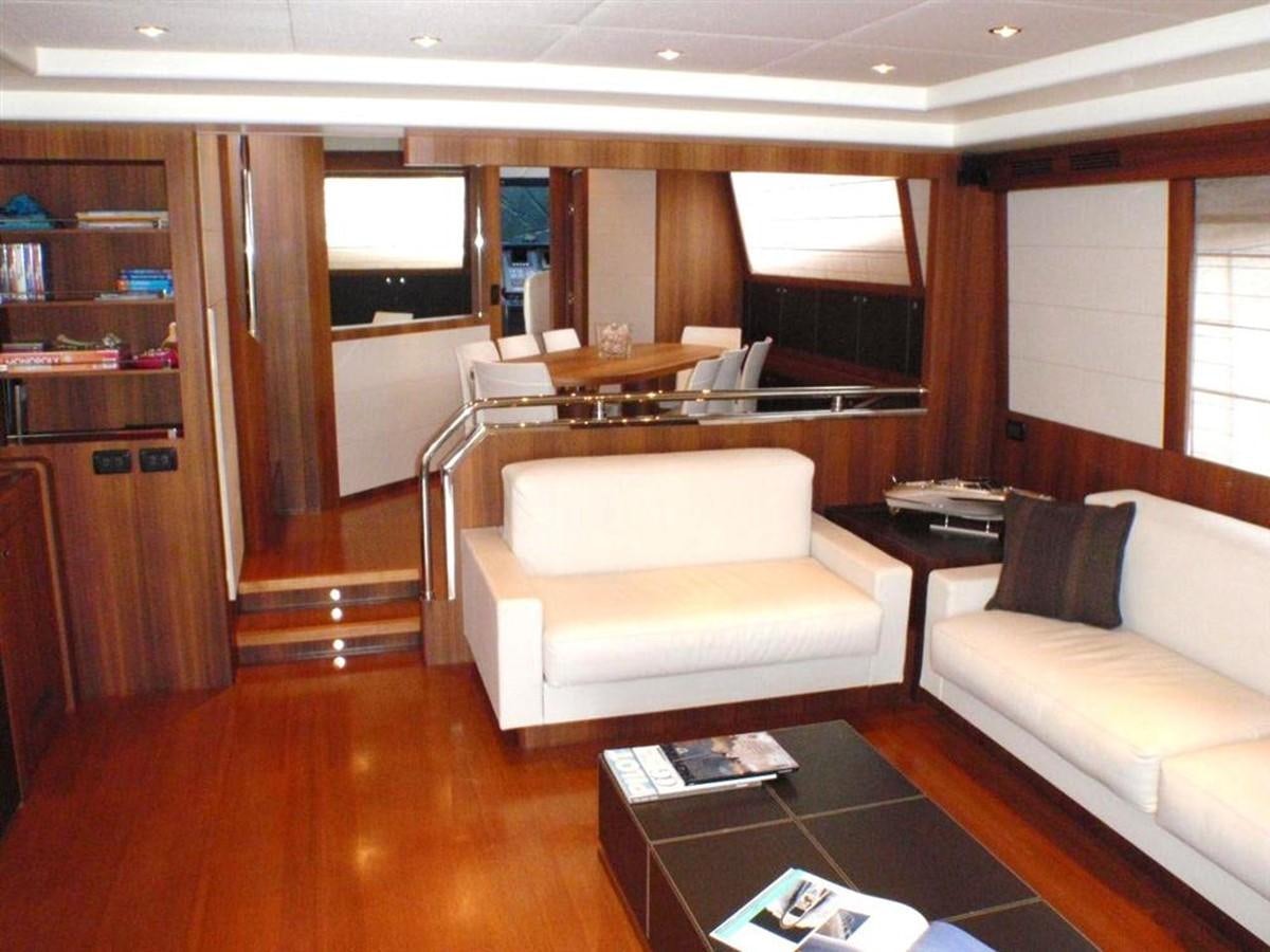 a living room with a couch and a table aboard 85' RIVA 85 OPERA Yacht for Sale