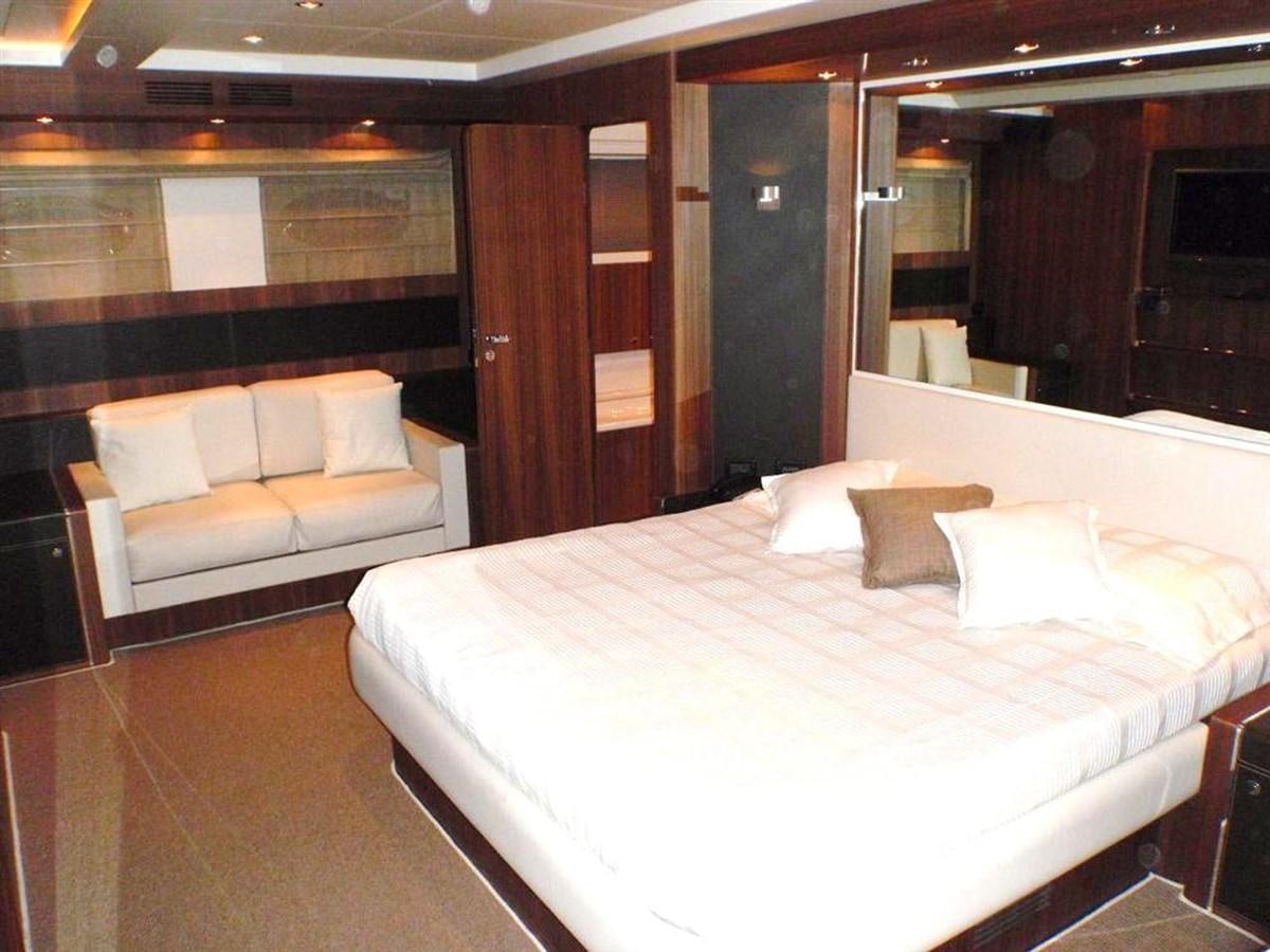 a hotel room with a bed aboard 85' RIVA 85 OPERA Yacht for Sale