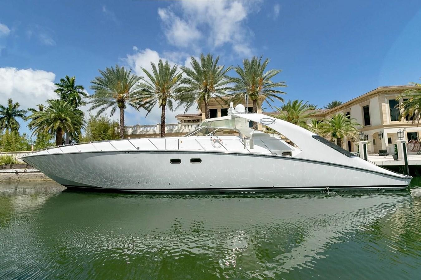 a white boat on the water aboard PURELY PLEASURE Yacht for Sale