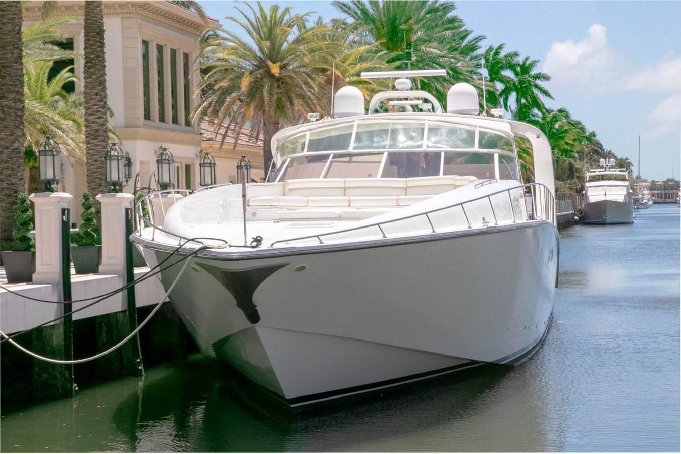 a white boat in the water aboard PURELY PLEASURE Yacht for Sale