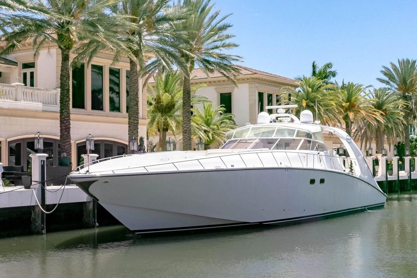 a white boat in a body of water aboard PURELY PLEASURE Yacht for Sale