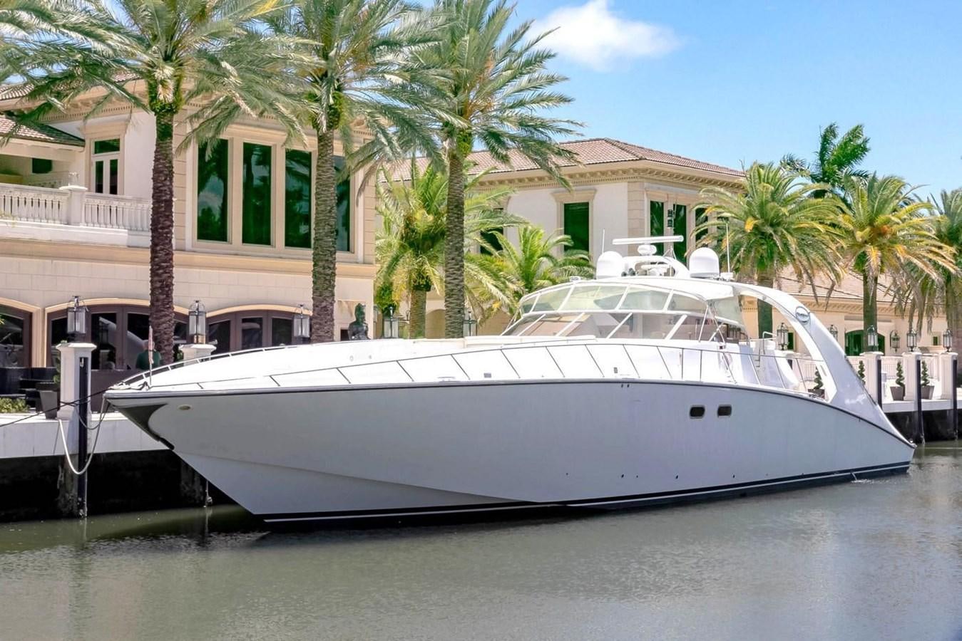 a white boat in a body of water aboard PURELY PLEASURE Yacht for Sale